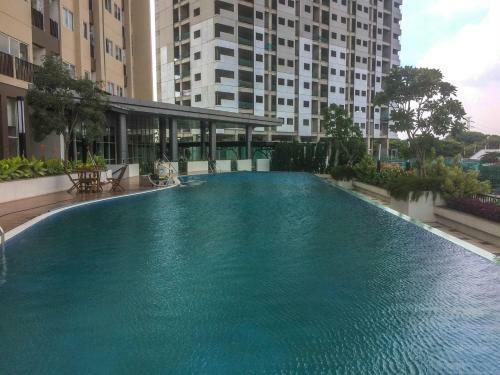 Homey Studio The Oasis Cikarang Apartment By Travelio