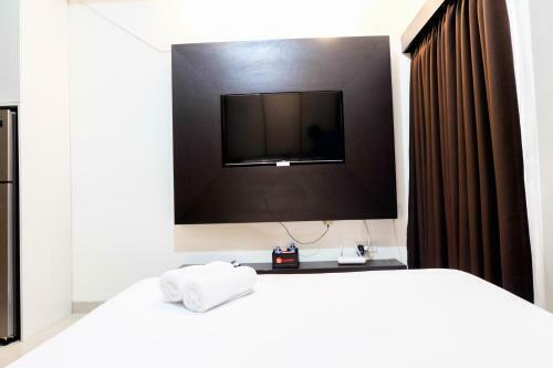 Homey Studio The Oasis Cikarang Apartment By Travelio
