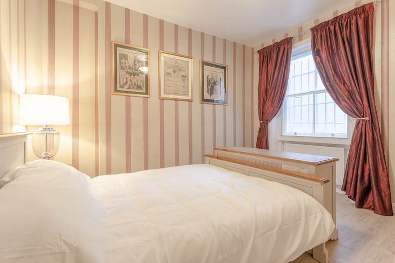 Elegant 2 Bedroom British Themed Apartment