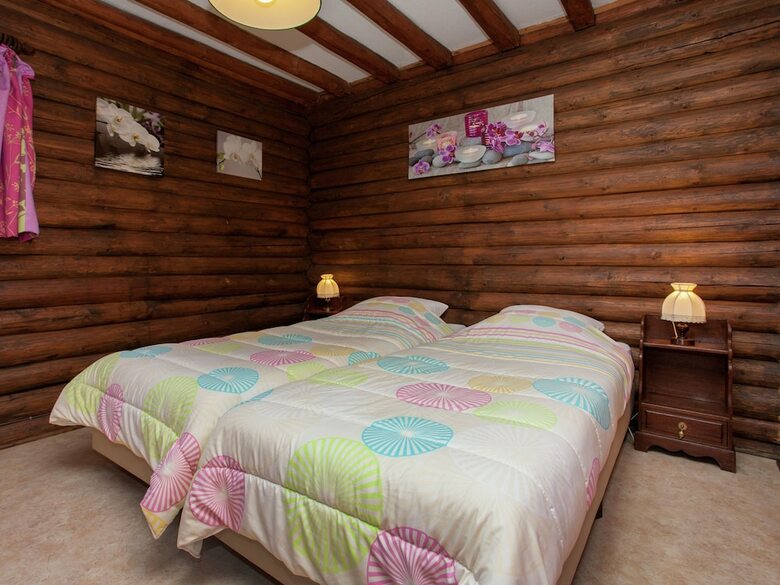 Open Wooden Chalet Built Against A Hill