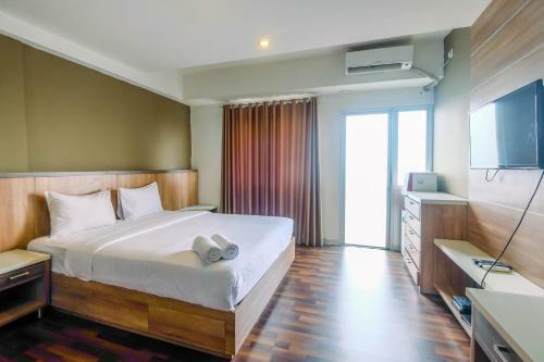 Modern And Cozy Studio Park View Apartment By Travelio