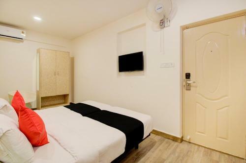 Capital O 77459 Smile Hotels