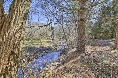 Quaint Creekside Home With Spacious Deck And Yard