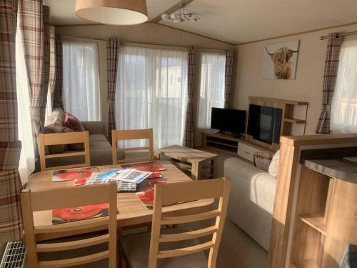 Woodpecker Lodge, Camelot Holiday Park, Ca6 5sz