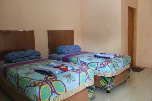 Hostal Penginapan Transit Tomato