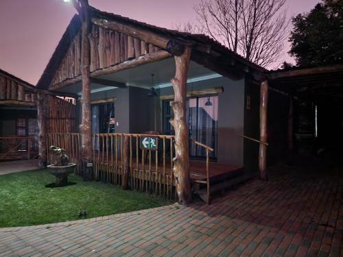 The Log Cabin Apartments Hotel