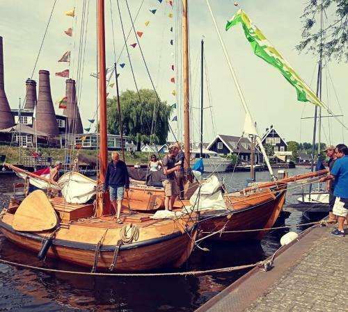 Characteristic Boat Near Amsterdam In Beautiful Harbor