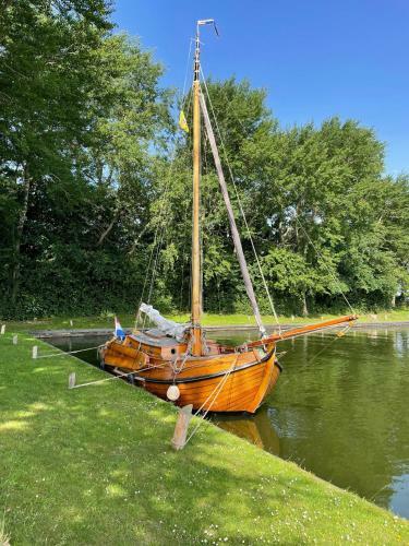 Characteristic Boat Near Amsterdam In Beautiful Harbor