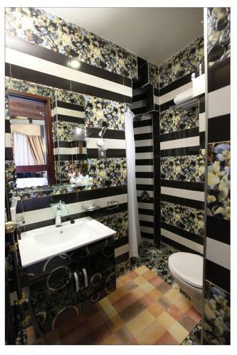 Apartamento Roomi Suites Hotel